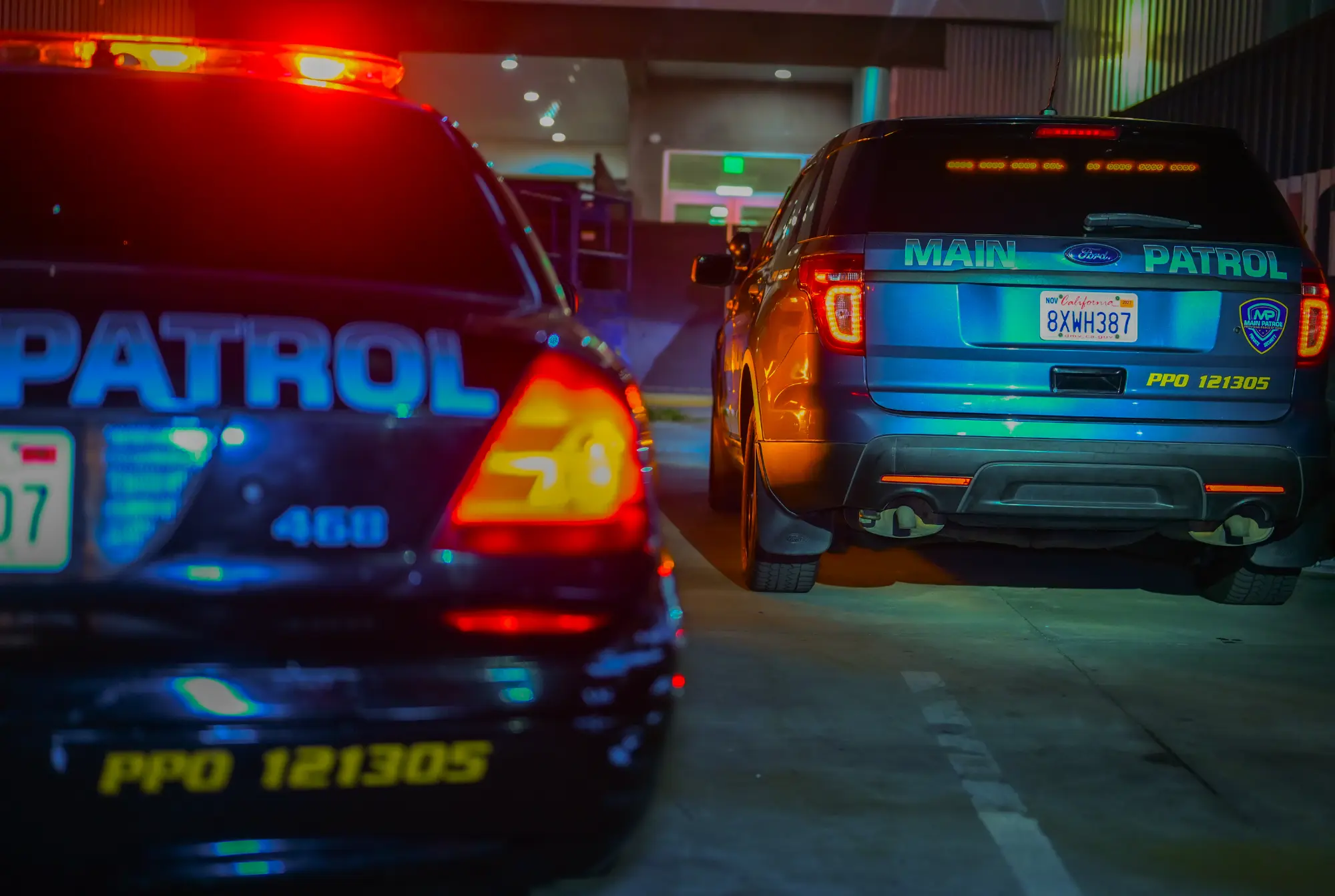 Two Main Patrol vehicles parked side by side at night
