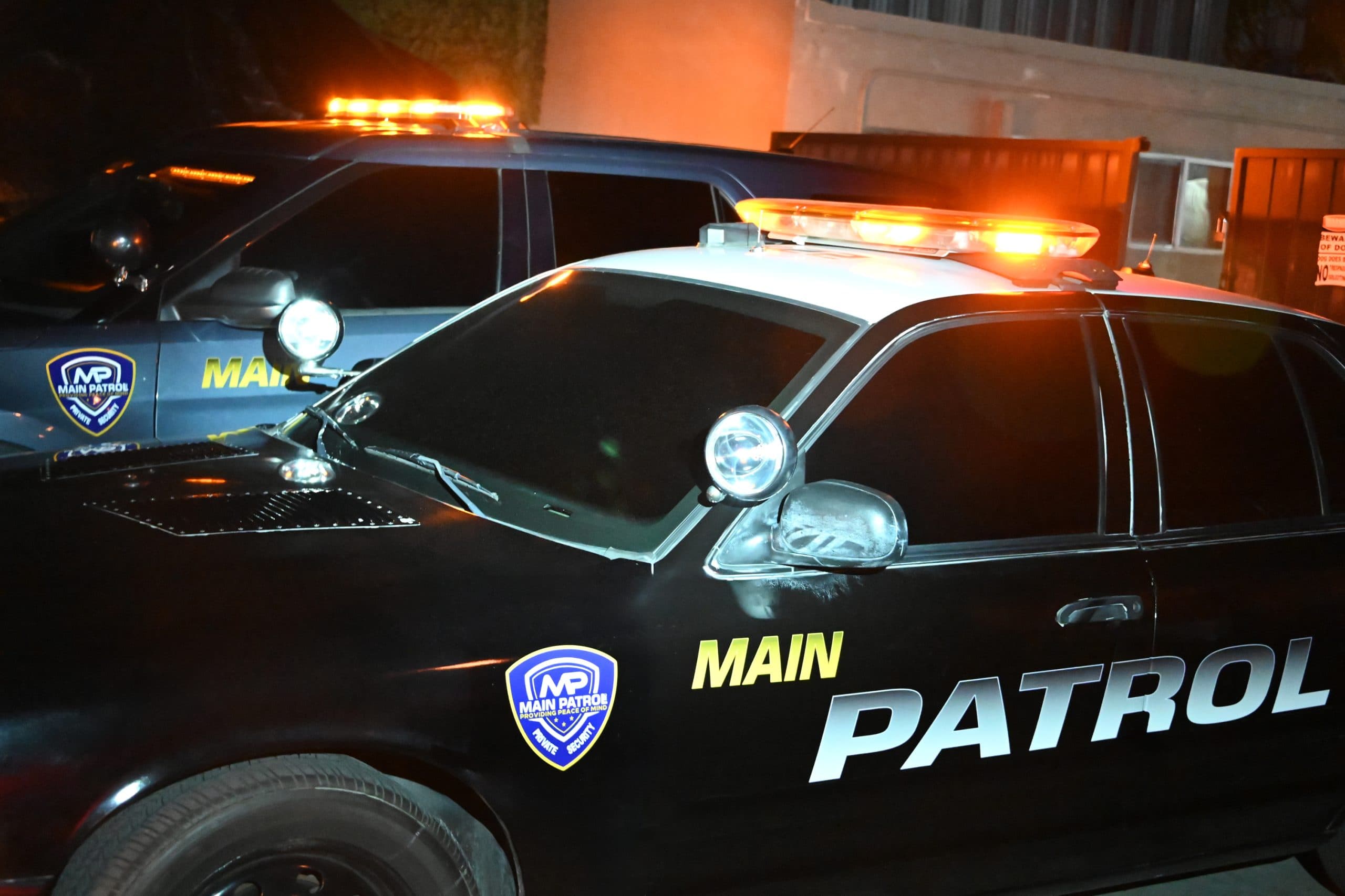 Main Patrol vehicle with light bar activated next to a second unit at night