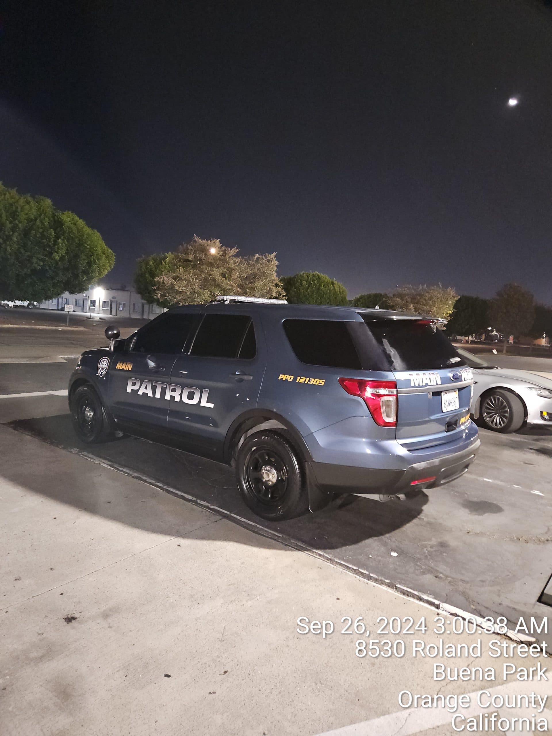 Officer at entry gate during a night patrol